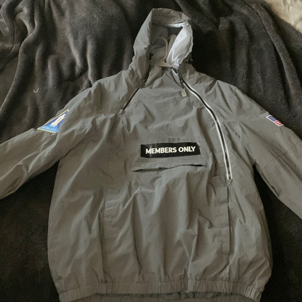 Reflective in light. Members only jacket.